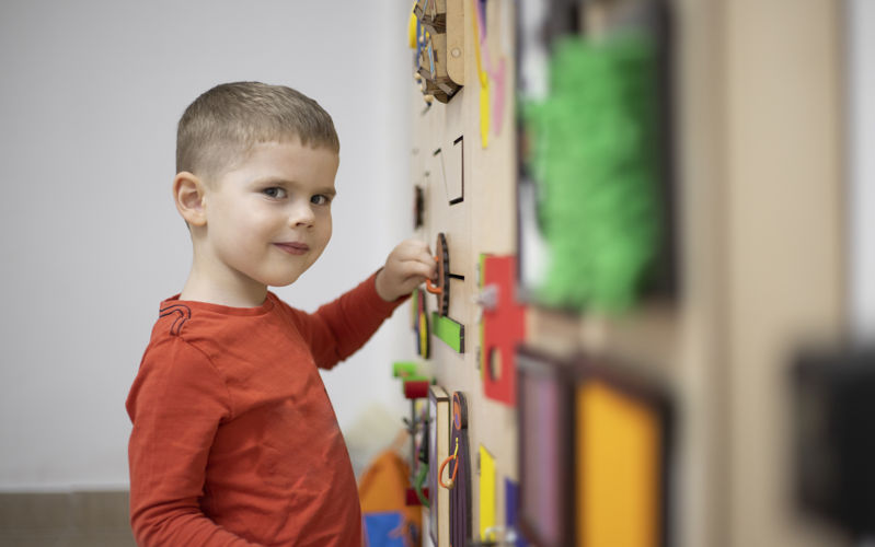 Young boy playing with shapes