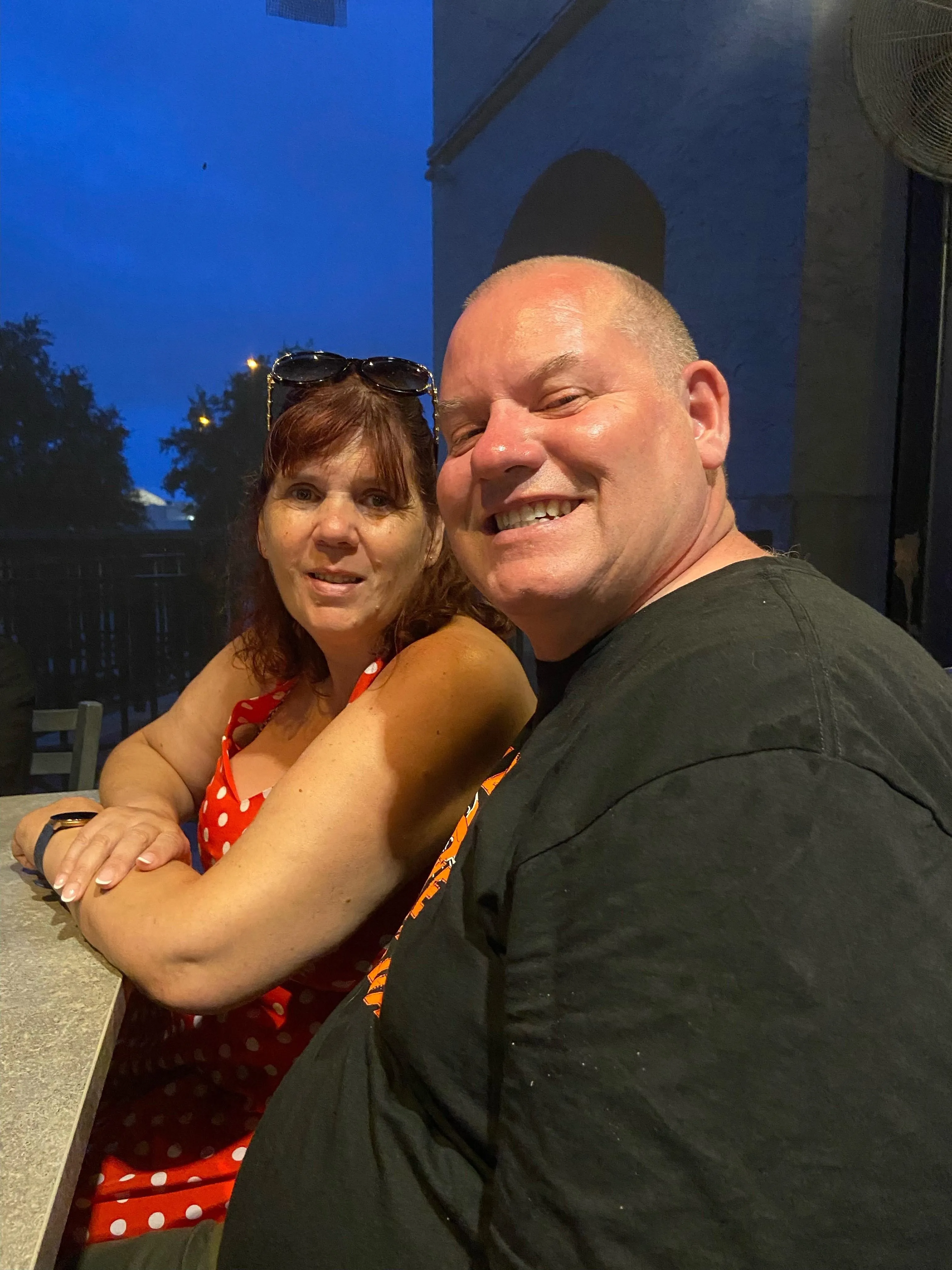 Two Blackpool Council foster carers, Gill and Colin, sat at a table